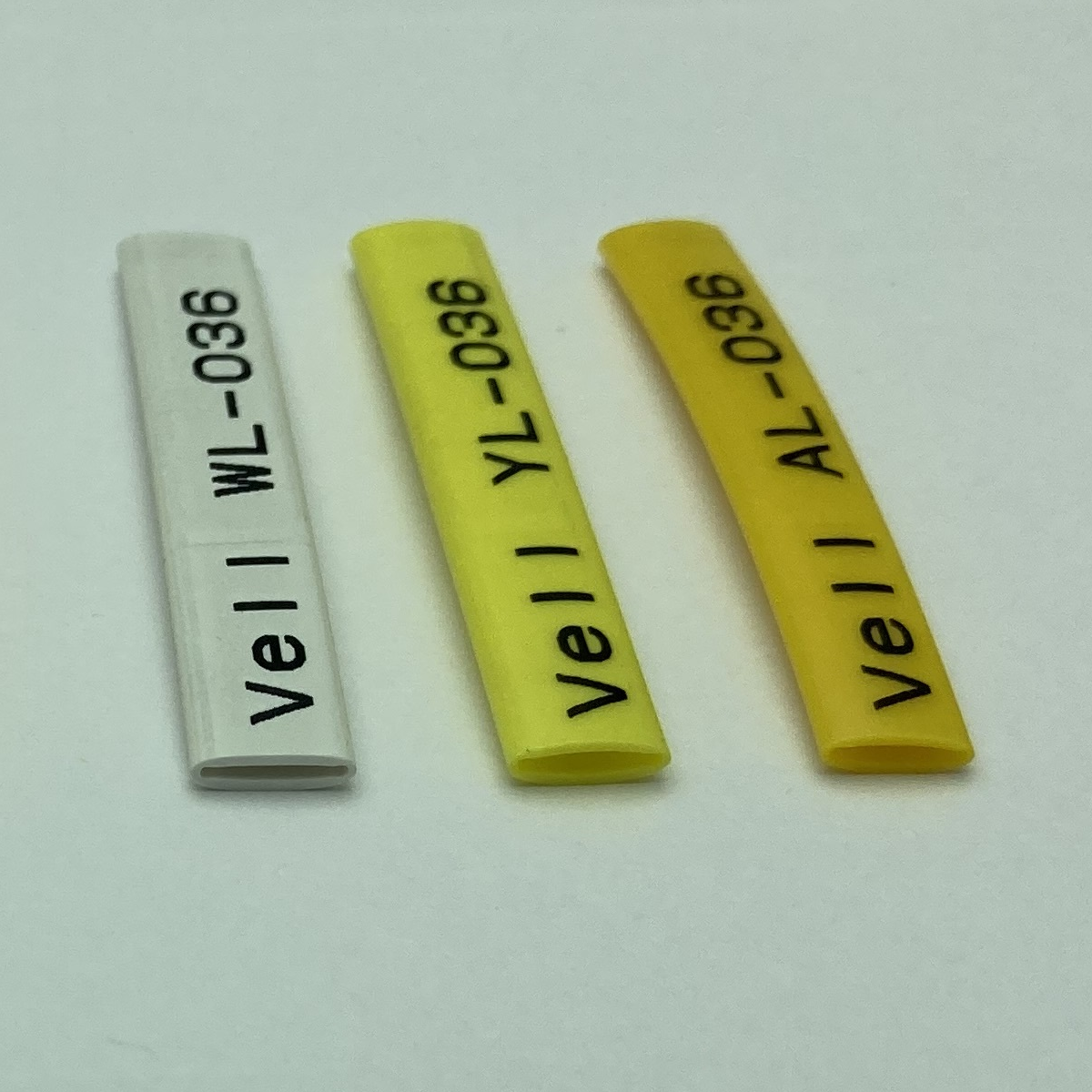 Фото Профиль ПВХ овальный Vell AL-036 для маркировки проводов, Ø 3,6 мм, 200 метров, янтарно-желтый, аналог Partex PO-06 (самозатухающий) {590396} (1)